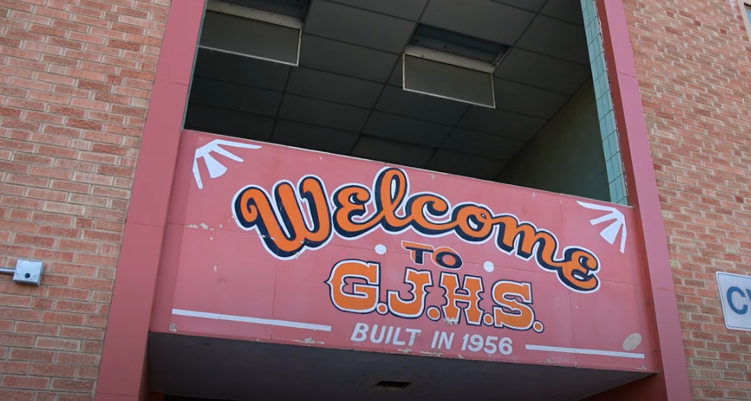 Sign from the front of the old Grand Junction High School building, reading "Welcome to GJHS, Built in 1956"